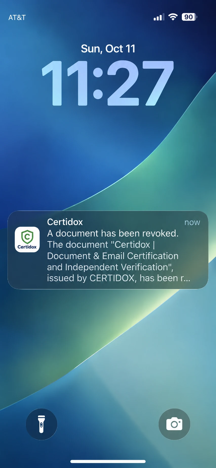 iPhone lock screen displaying the Certidox notification that a document has been revoked